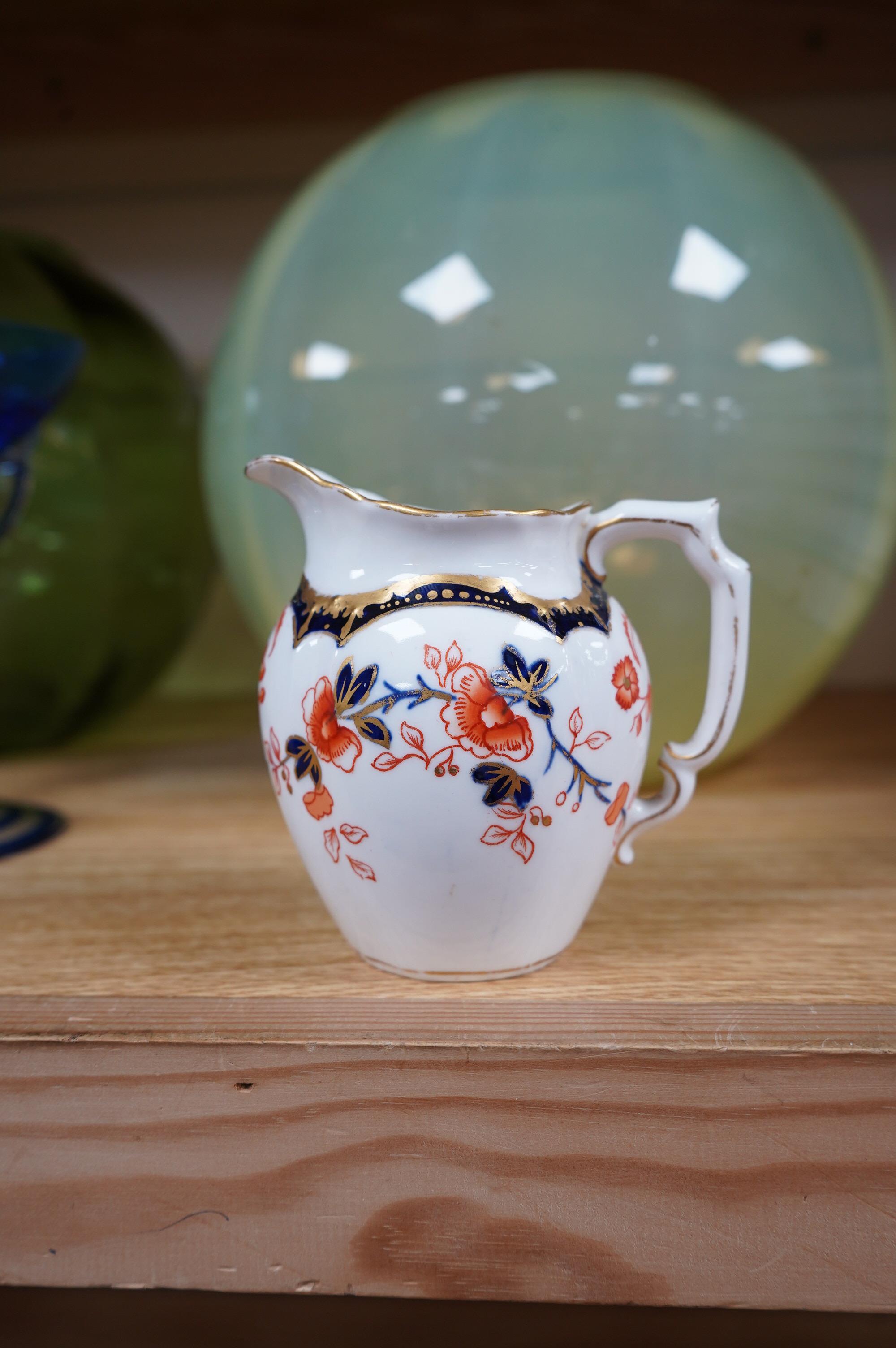 A Royal Crown Derby Imari porcelain part tea set to include sandwich plates, trios and milk jug. Condition - varies, some breaks